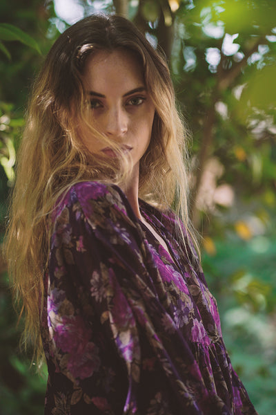 Deadstock dress with deep V-neckline, a kimono poet sleeve with elastic at the wrists midi length, and a sheered empire waist | Love Faustine