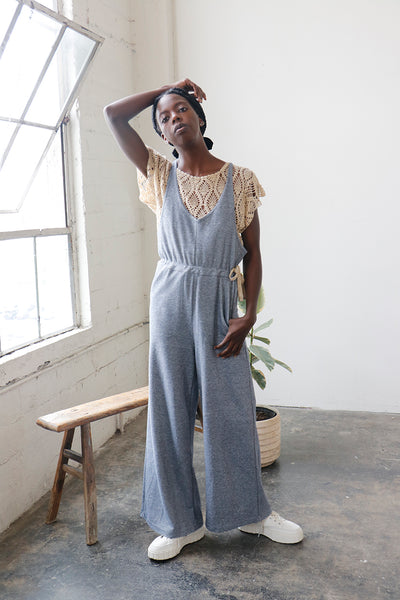 Wide leg jumpsuit with waist tie and front pockets | Love Faustine