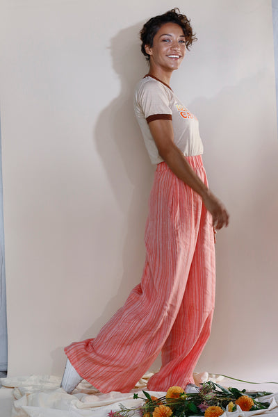 pink stripe wide-leg linen lounge pants featuring a high-rise pull-on style and elastic waistband | Love Faustine
