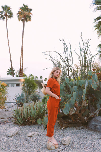 burnt orange utility jumpsuit with collar, front zipper and pockets | Love Faustine