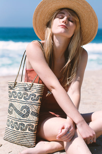 handwoven natural rattan beach tote with woven design | Love Faustine