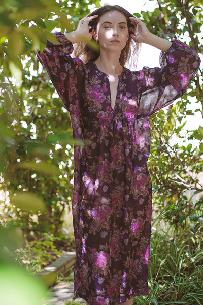 Sustainable dress with deep V-neckline, a kimono poet sleeve with elastic at the wrists midi length, and a sheered empire waist | Love Faustine